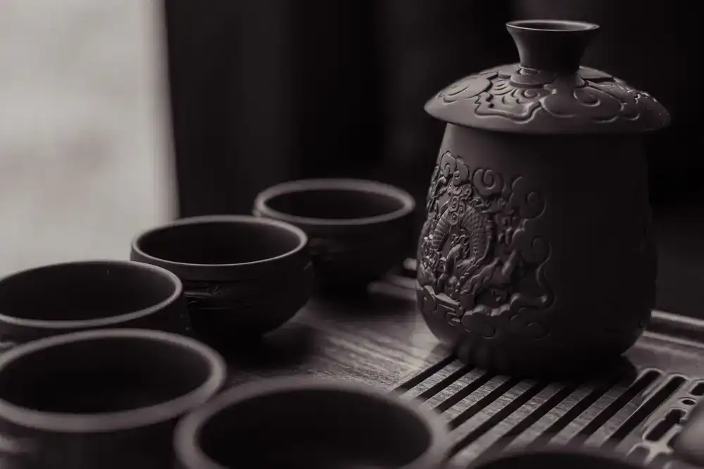 Close-up of tea brewing in a dark, atmospheric setting